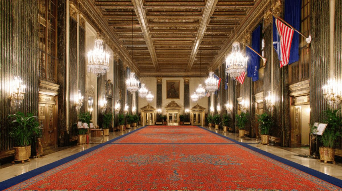 Elegant hall with chandeliers and red carpet