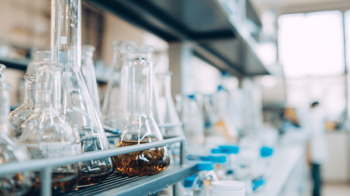 Laboratory flasks and equipment on a shelf
