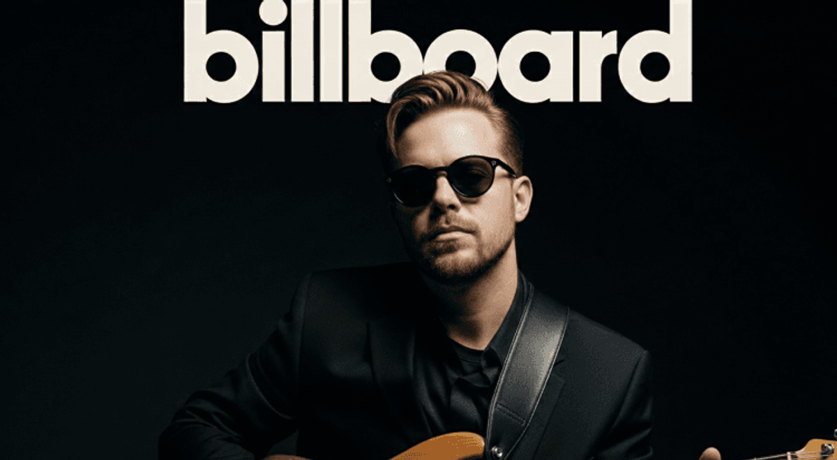Musician in sunglasses holding guitar, Billboard cover.