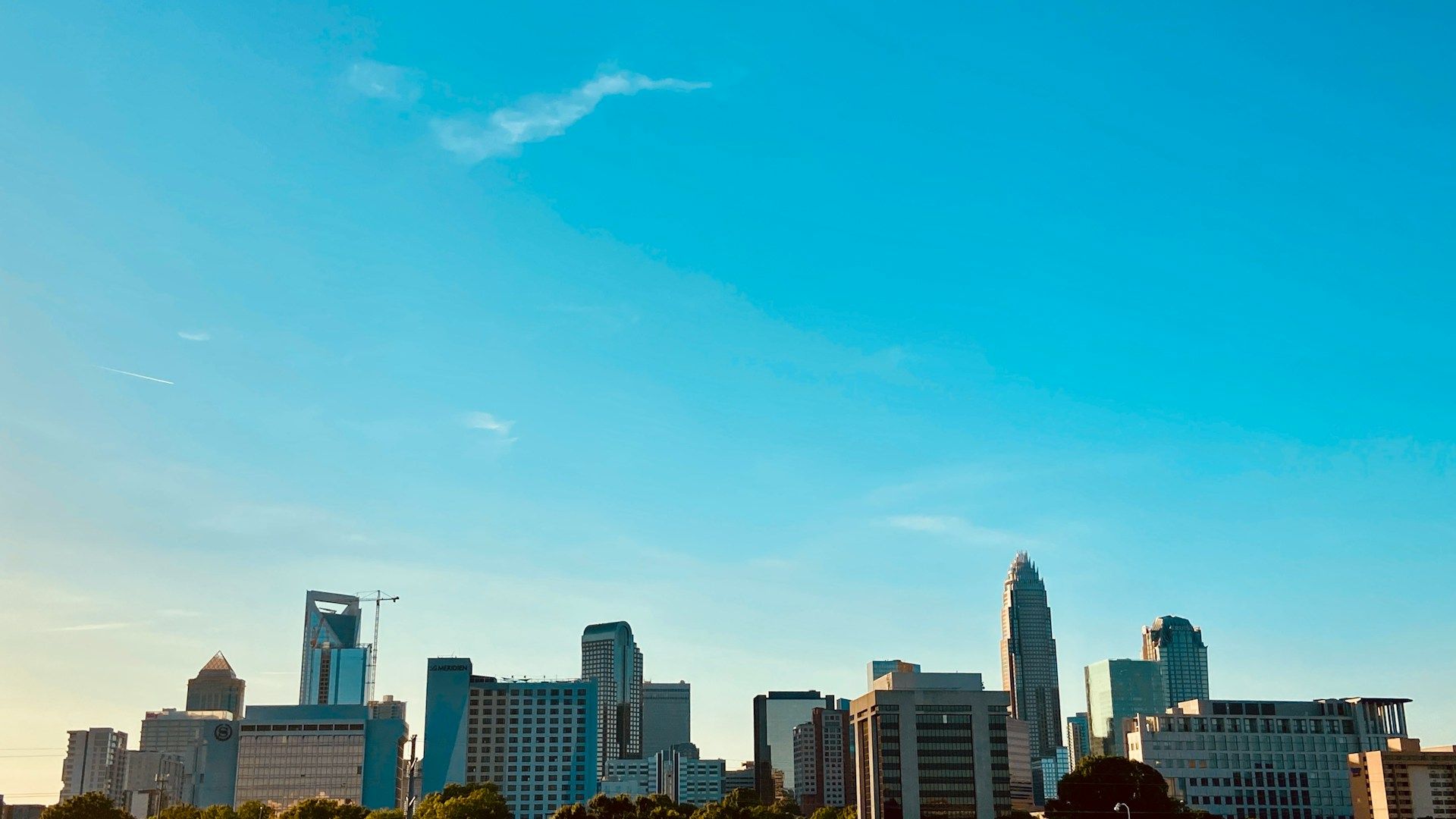 Uptown Charlotte skyline against a clear sky — marketing services in Charlotte