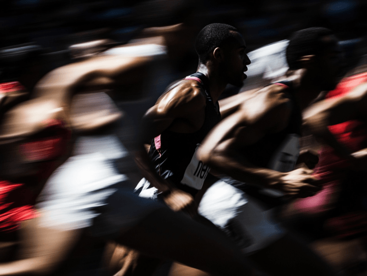 Runners in motion during a race, blurred effect.