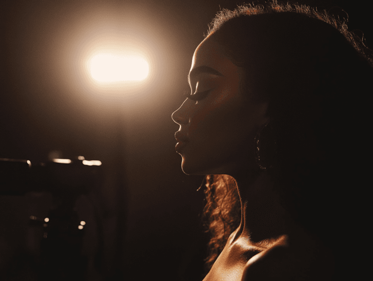 Silhouette of woman in dramatic studio lighting