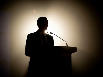 Editorial silhouette at press podium