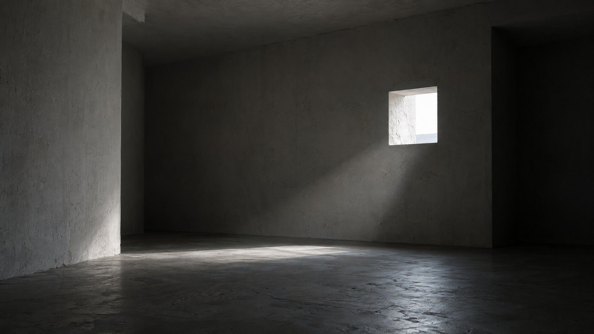 Small opening cut in a concrete wall letting in light