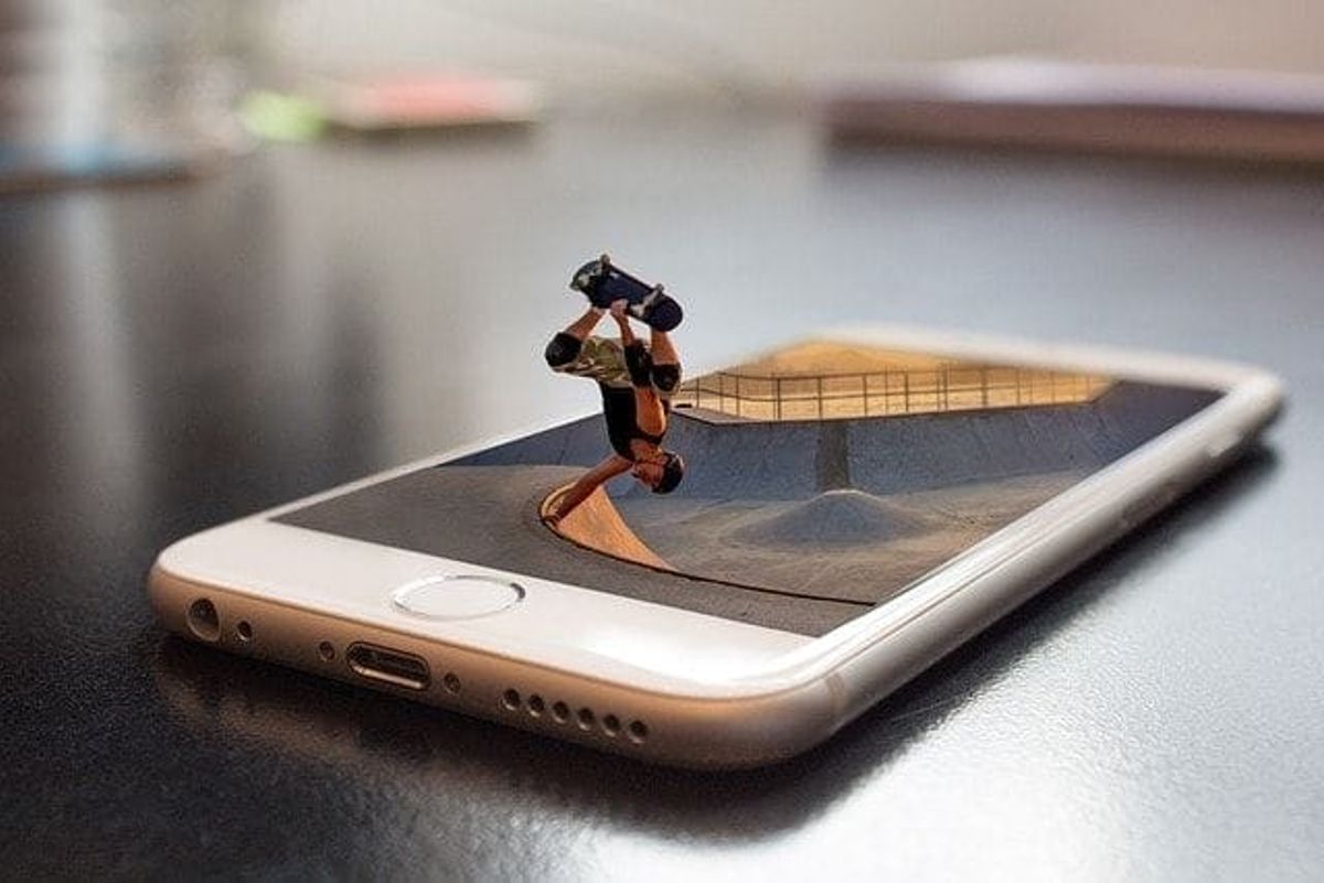 miniature, skateboarding, skateboarder, mobile device, creating content, engaging manner, visual content