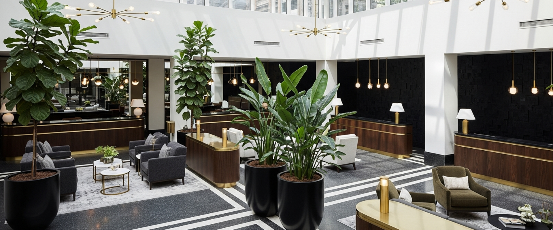 Luxury boutique hotel lobby with terrazzo floors and brass accents