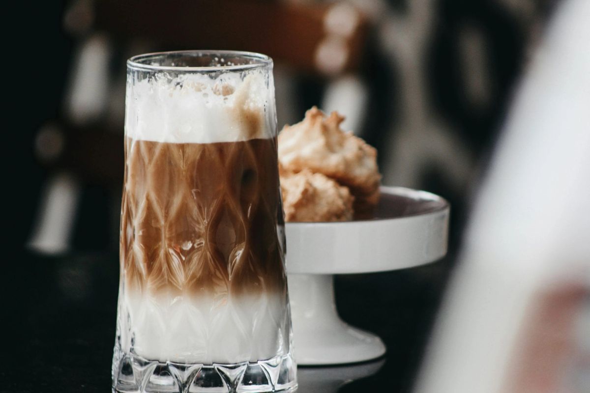 Iced coffee and cookies on a table