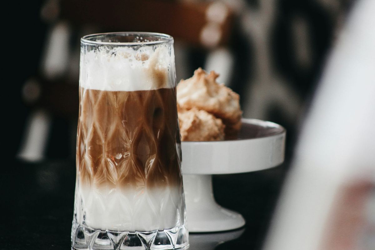 Iced coffee and cookies on a table