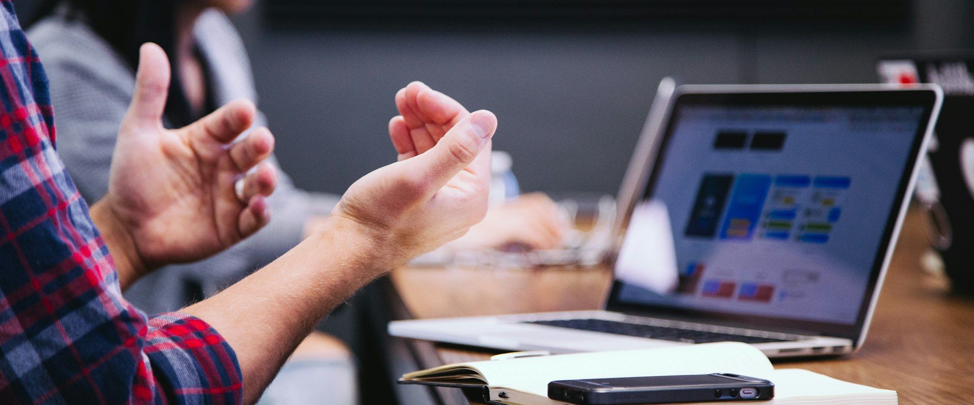 Business team discussing PR strategy in modern office