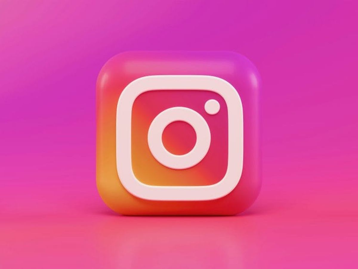 3D Instagram logo on pink background.