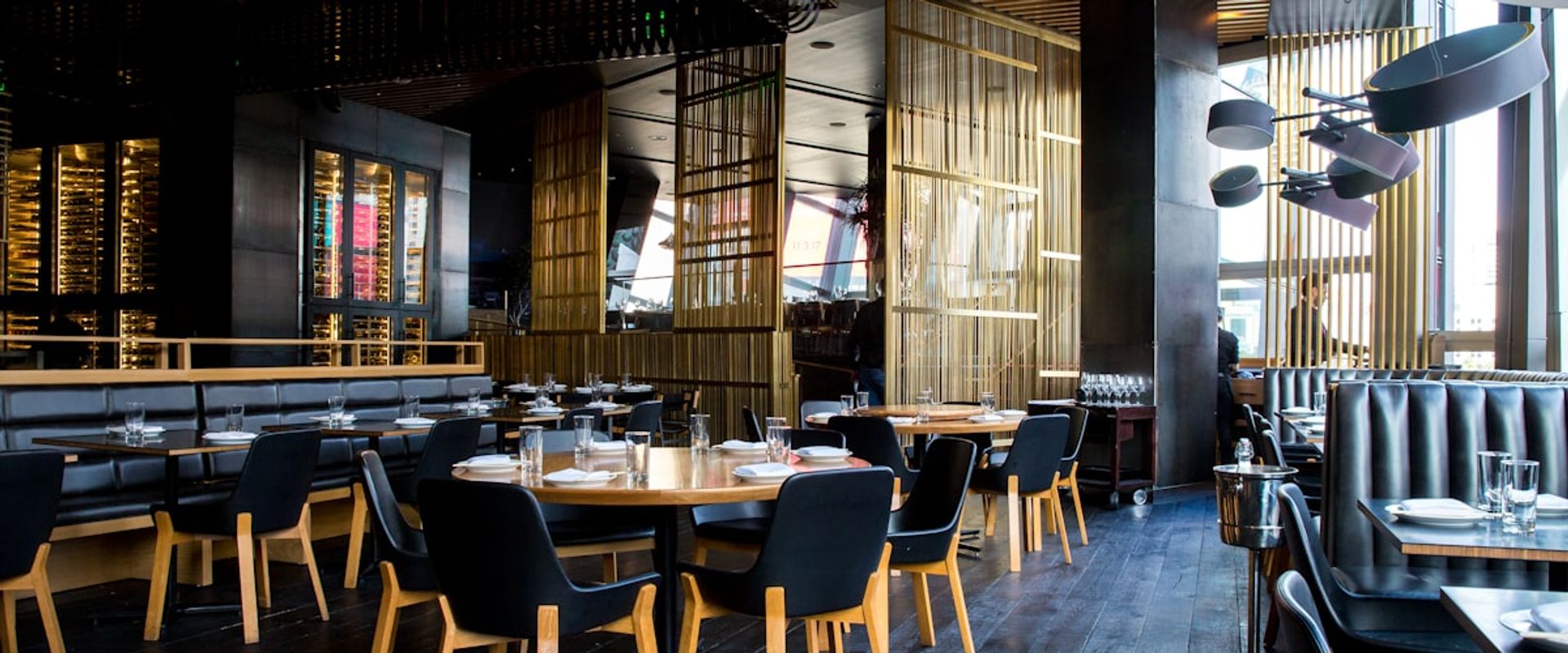 Elegant restaurant interior with warm lighting representing hospitality public relations