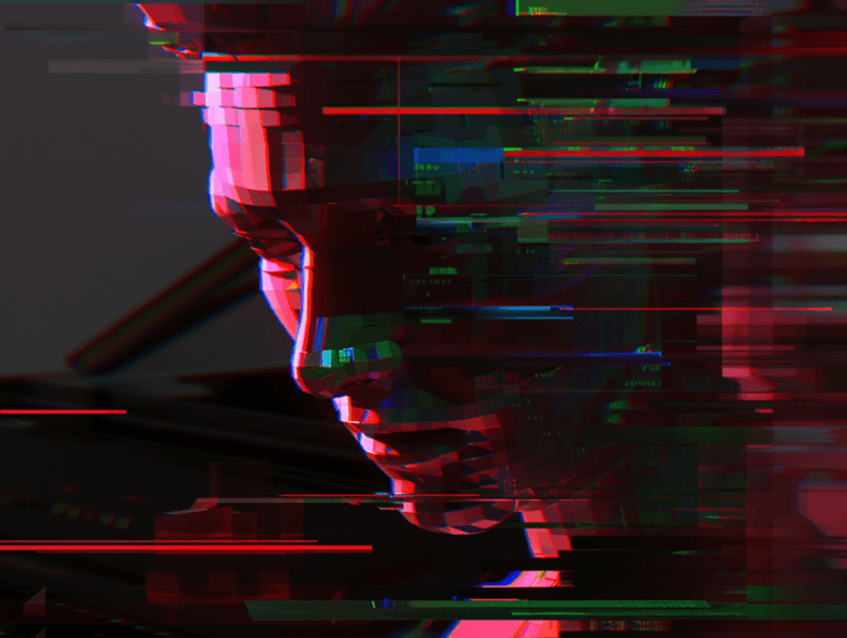 Glitch art with distorted human face in profile.