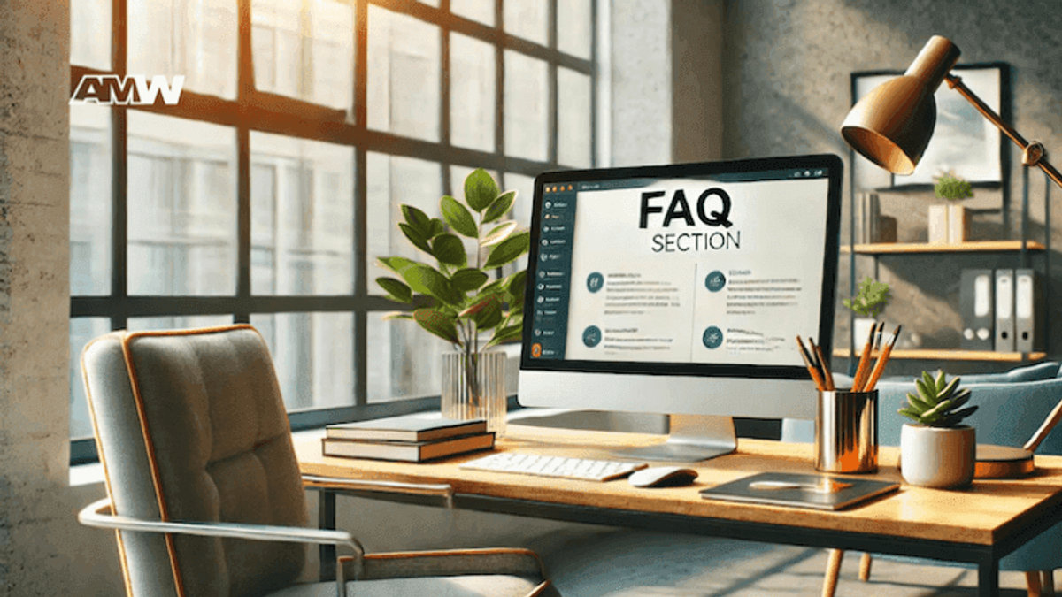 Modern desk with FAQ section on computer screen.