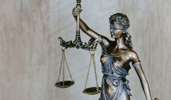 Law books and gavel representing legal industry