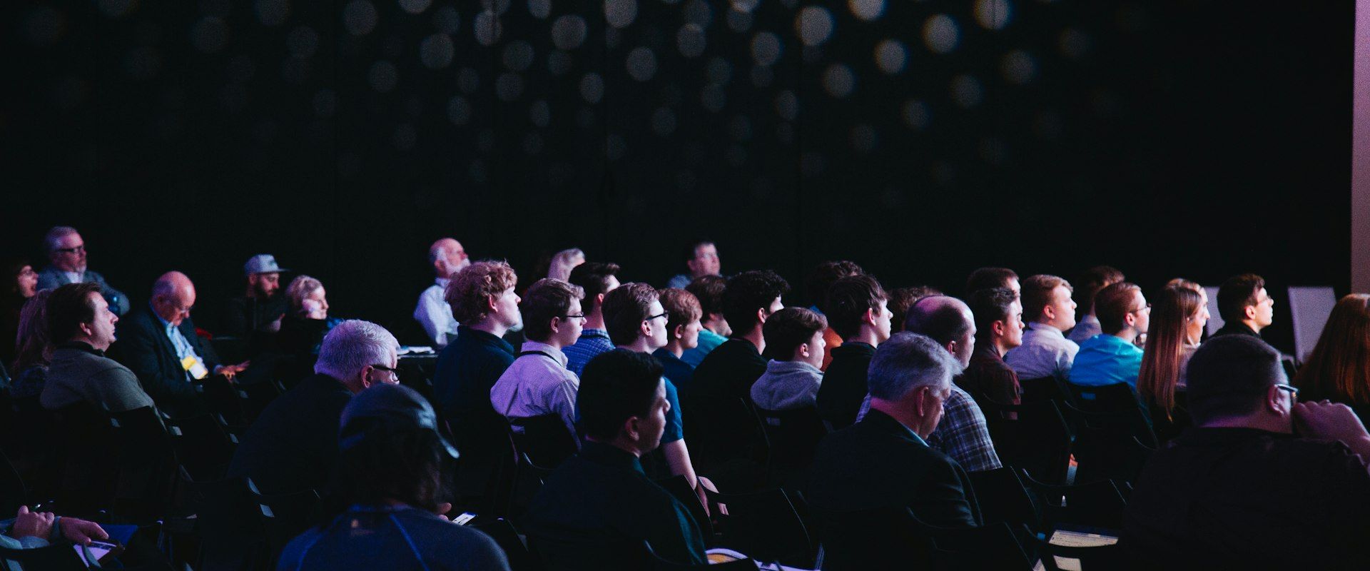 Large corporate conference with professional stage setup - Corporate Conference Management