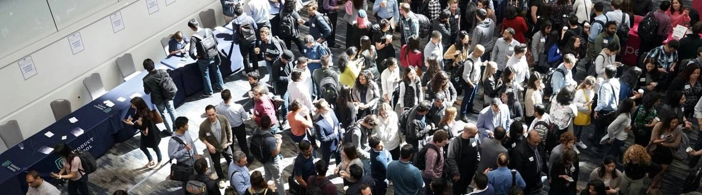 Trade show venue with professionals gathering around