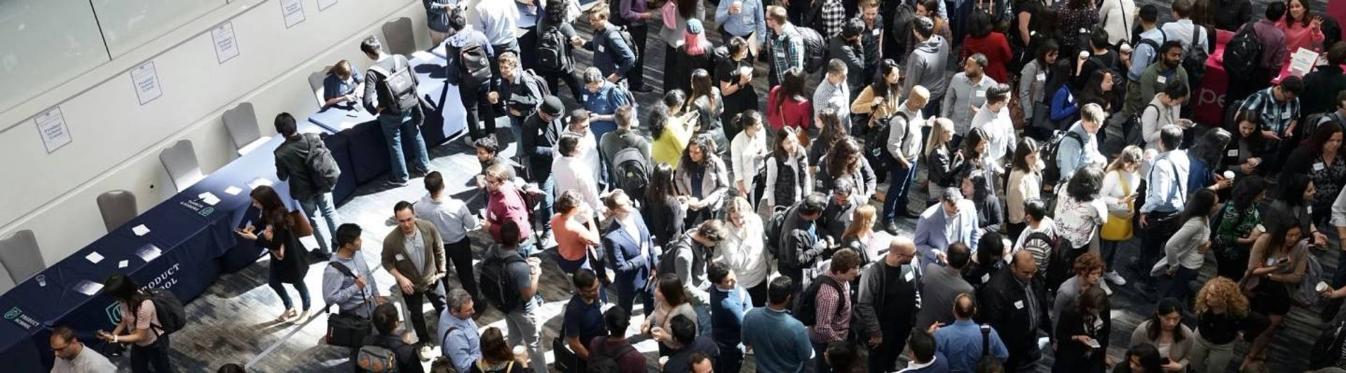 Trade show venue with professionals gathering around