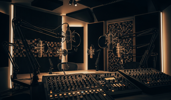 Professional podcast studio with microphones, acoustic treatment, and audio equipment