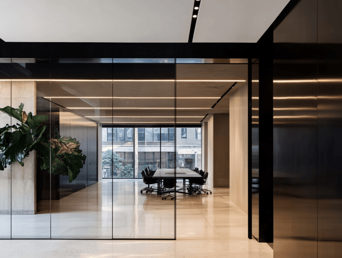 Modern glass-walled conference room with city view