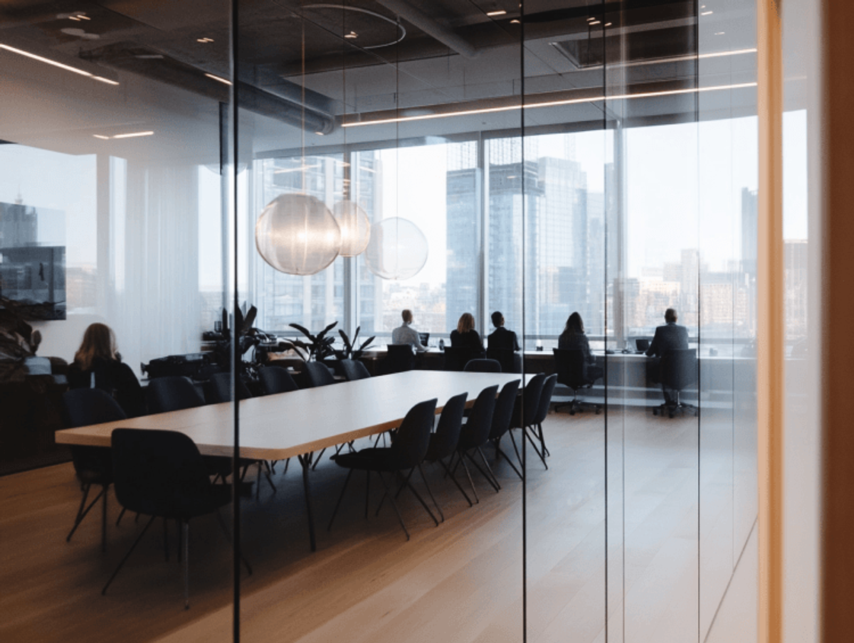 Elegant office space with large windows and city view.