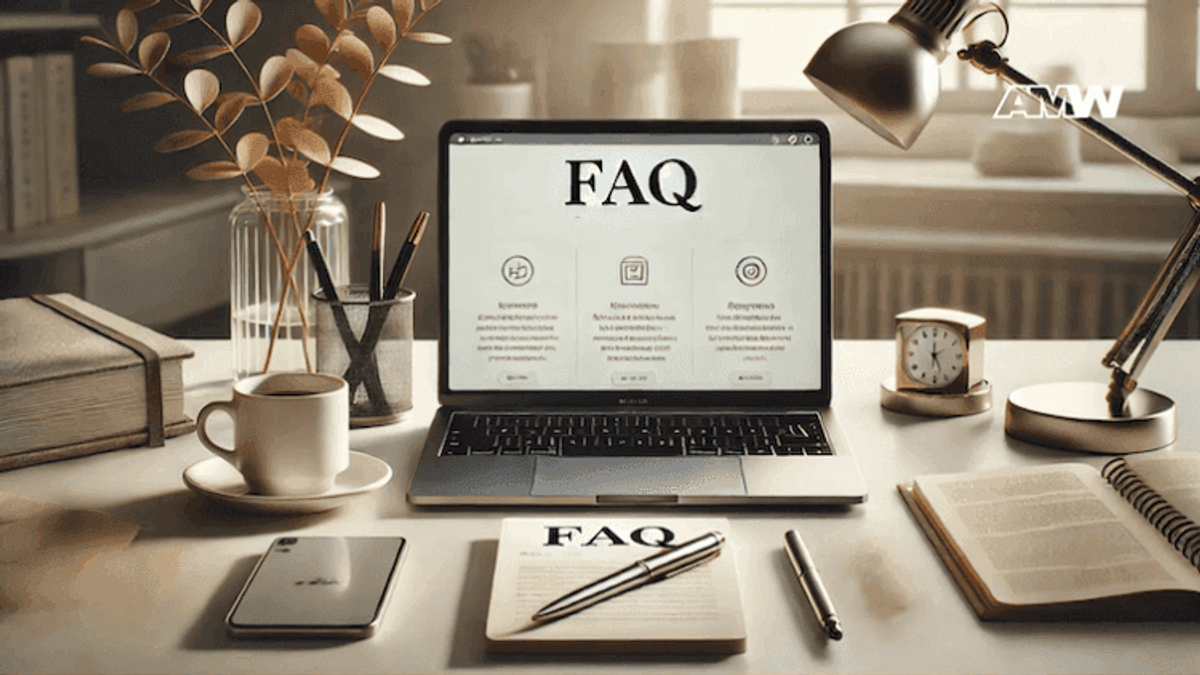 Laptop displaying FAQ page on a desk.