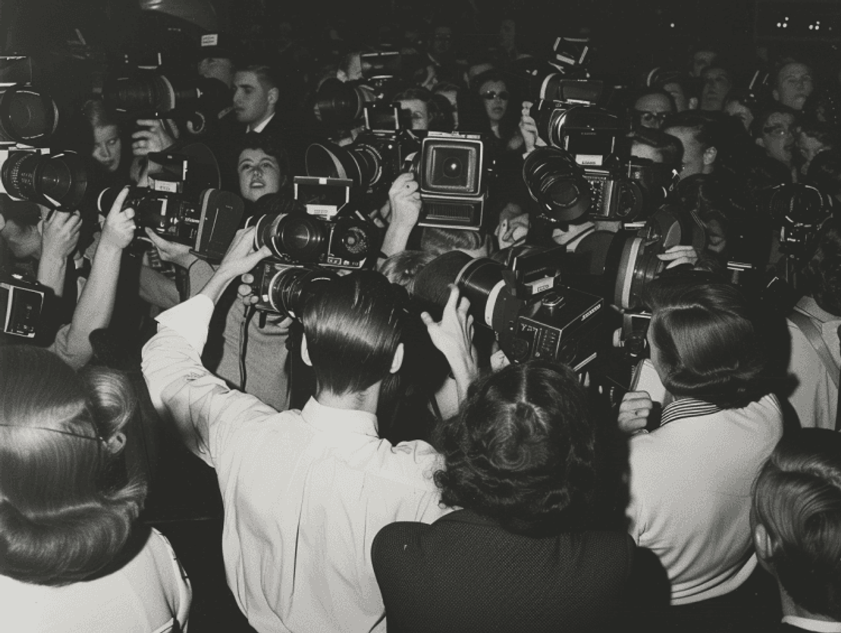 Photographers crowding to capture an event.