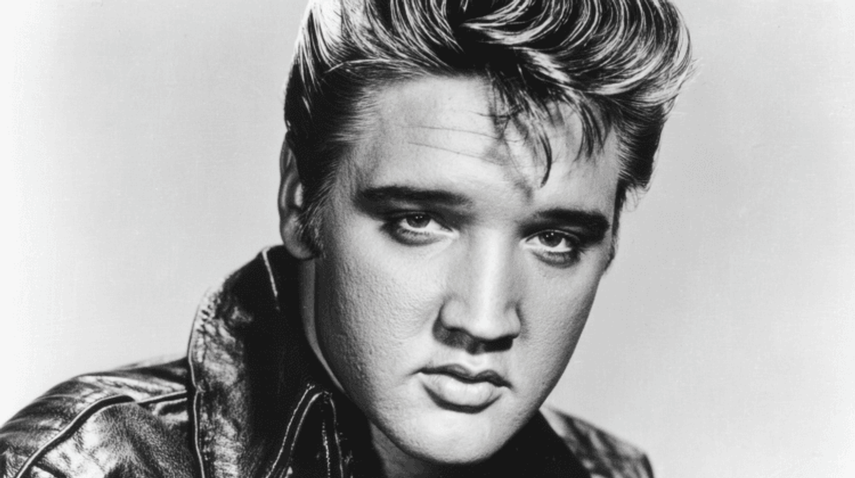 Black and white portrait of a man in leather.