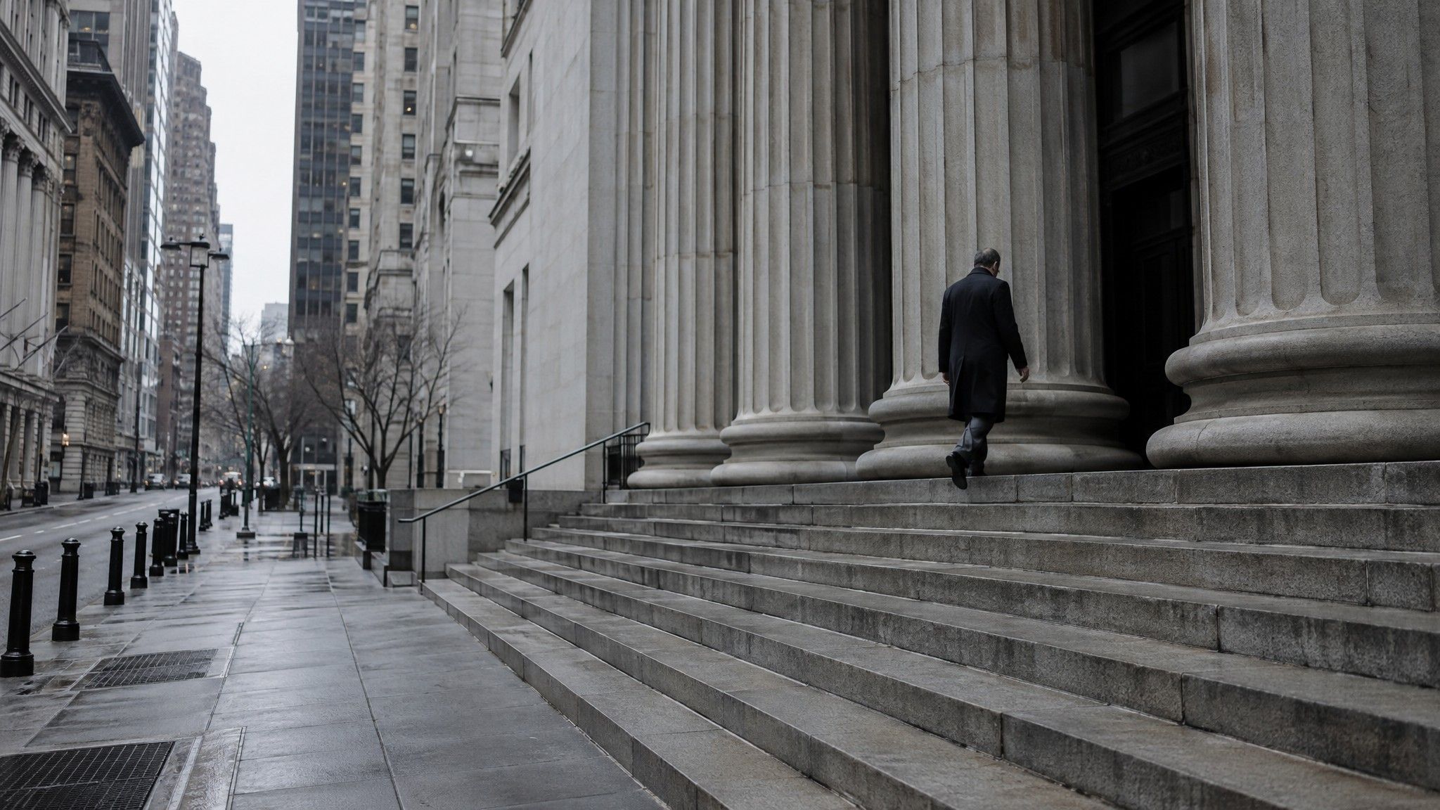 Granite steps and columns of a financial building with one figure