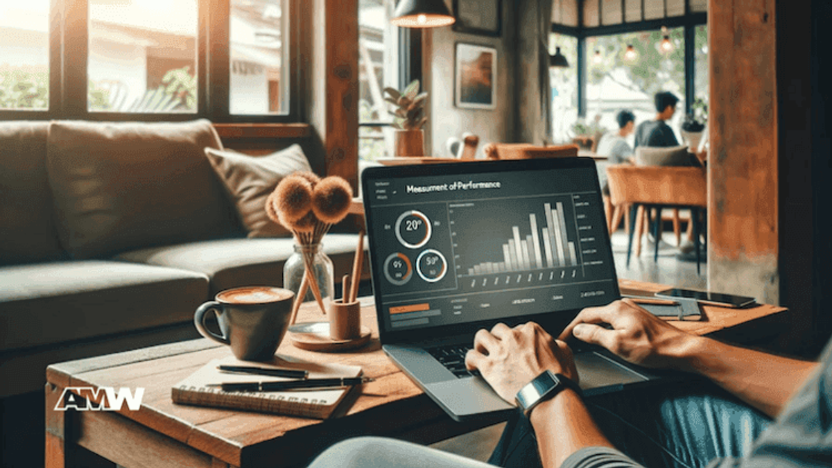 Person analyzing performance charts on laptop in cafe.