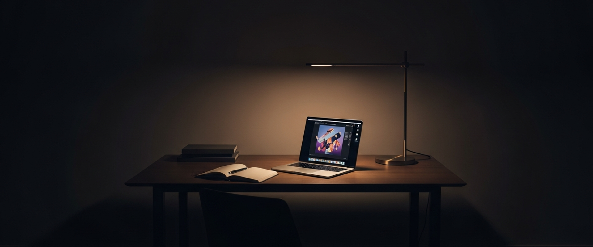 Minimalist design studio at dusk with warm desk lamp lighting