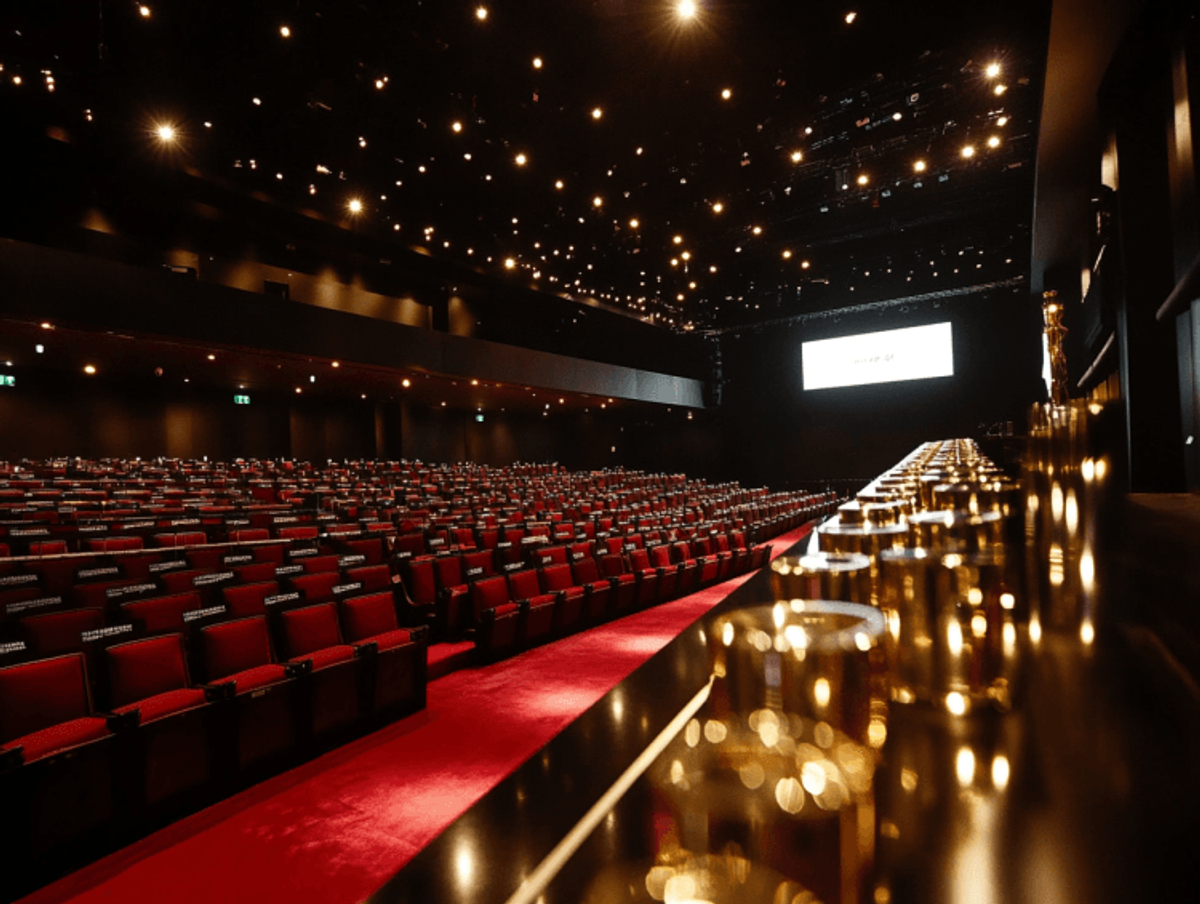 Empty theater with red seats and dim lighting
