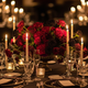 Luxury event table setting with dramatic dark floral centerpiece, taper candles, and crystal glassware