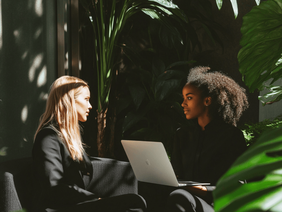 Two women having a business meeting with laptop