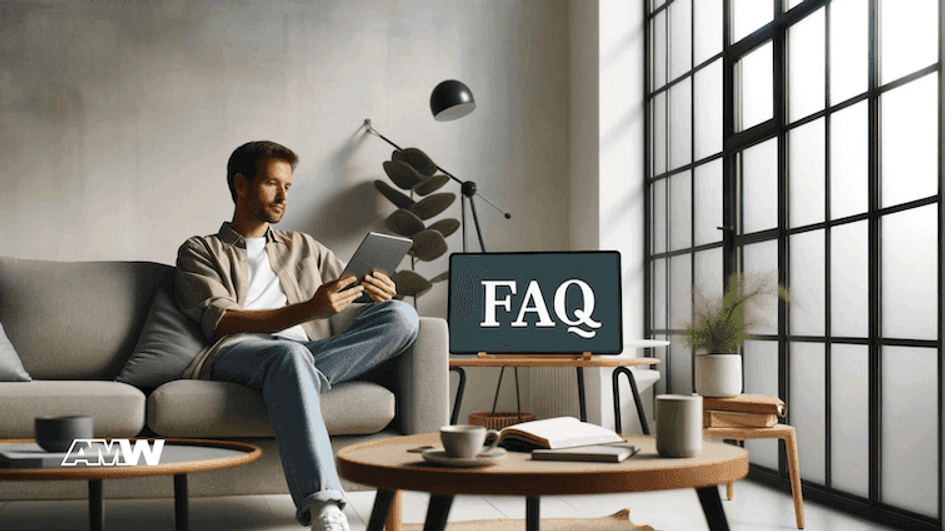 A man sitting on a sofa reading a tablet, with a screen on the coffee table displaying the word FAQ