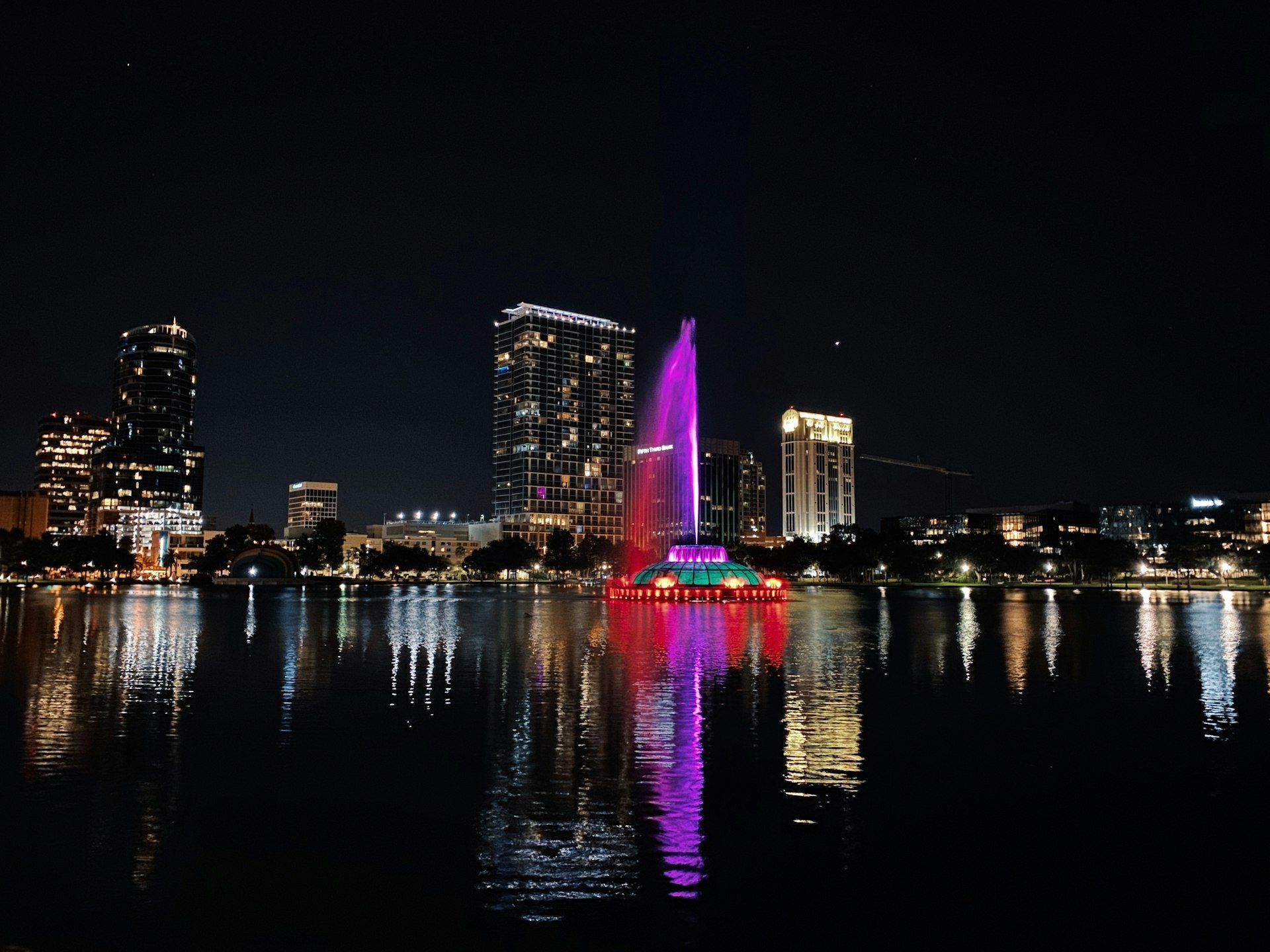 Orlando Florida city skyline at night with illuminated buildings