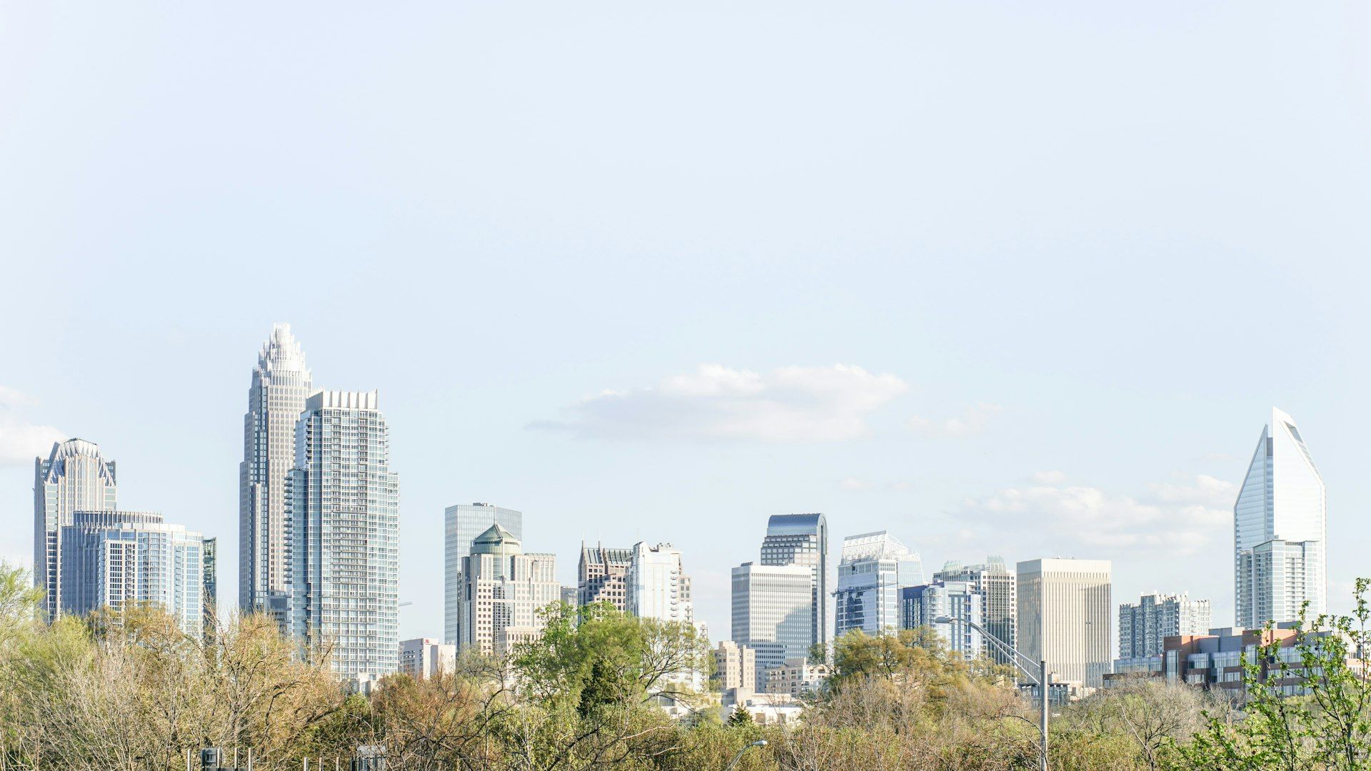 Charlotte North Carolina city skyline with trees and modern buildings
