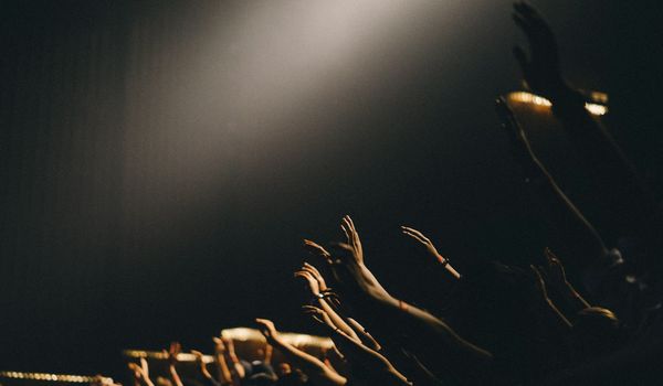 Dramatic film set with professional lighting equipment and camera crew in production