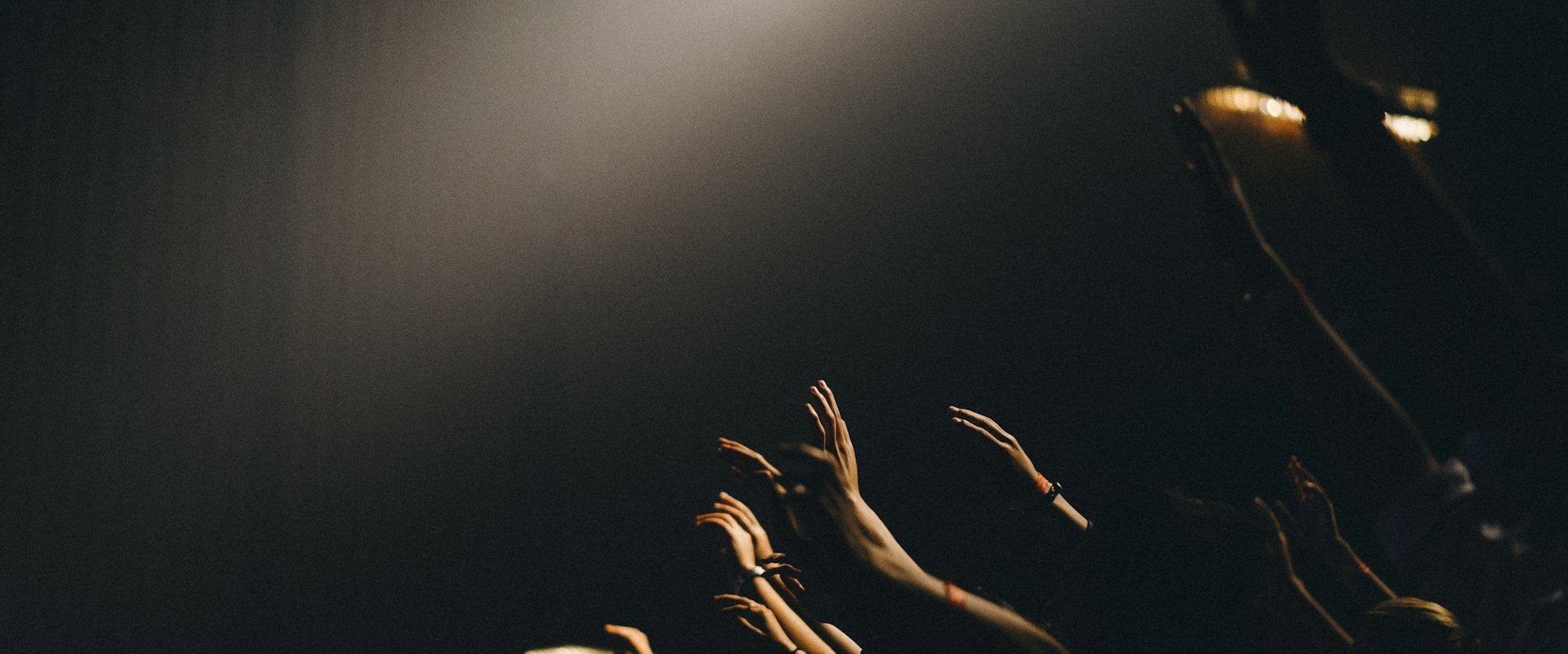 Dramatic film set with professional lighting equipment and camera crew in production