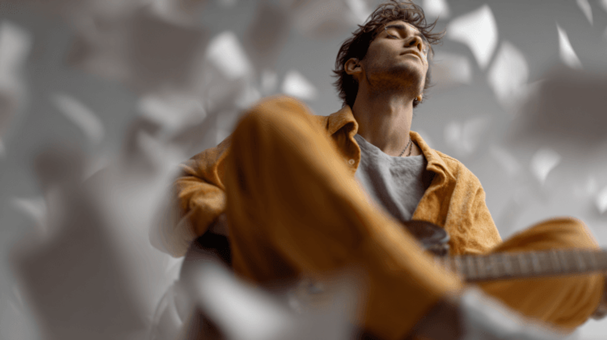 Man in yellow outfit with fluttering papers