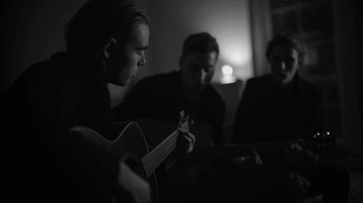 Three people playing guitars in dimly lit room.