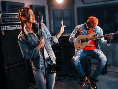 Music industry professional working on maximizing music promotion: digital platforms for brand exposure and success