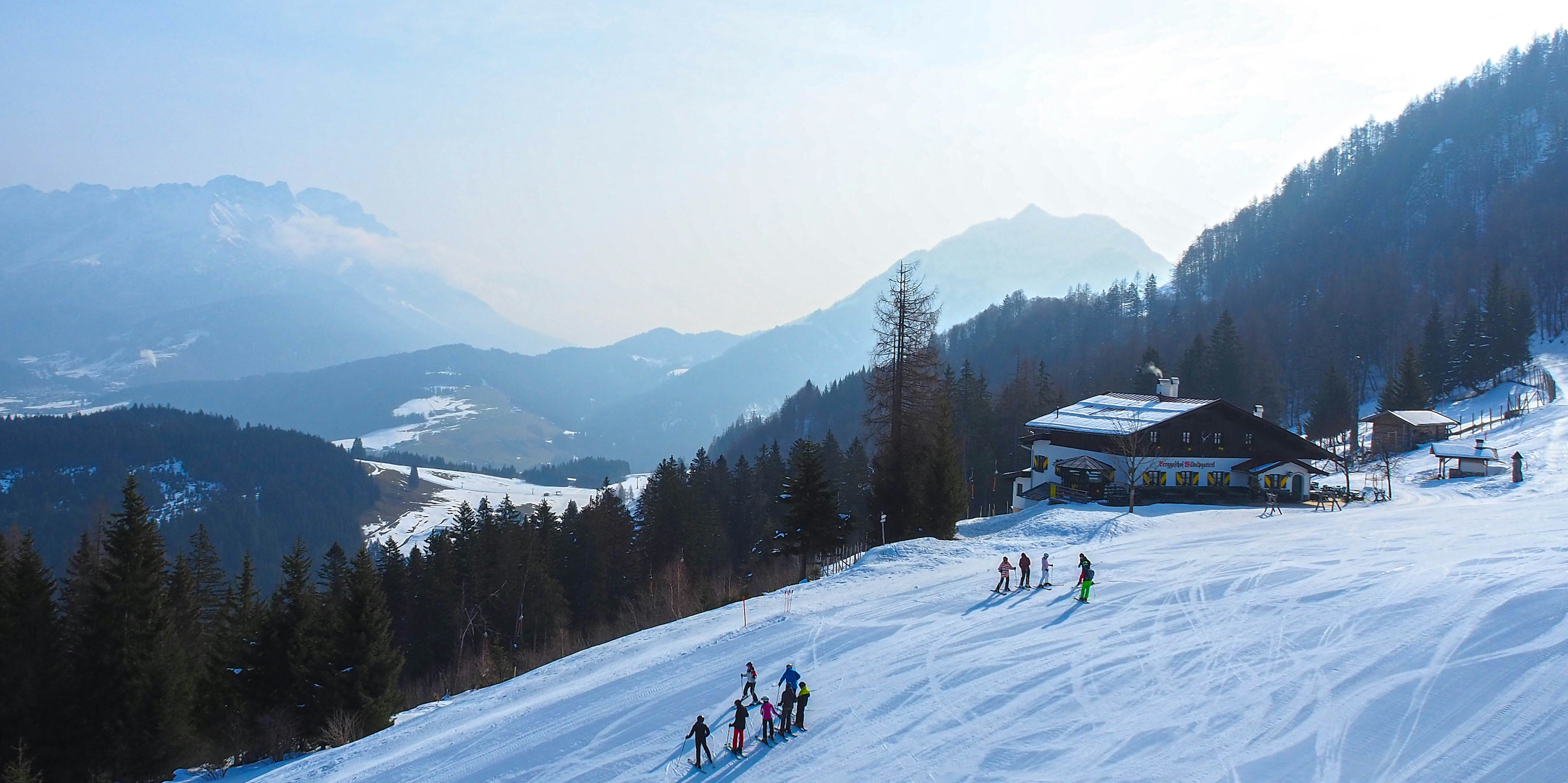 Marketing team discussing ski resort marketing secrets that turn seasonal visitors into lifelong mountain enthusiasts