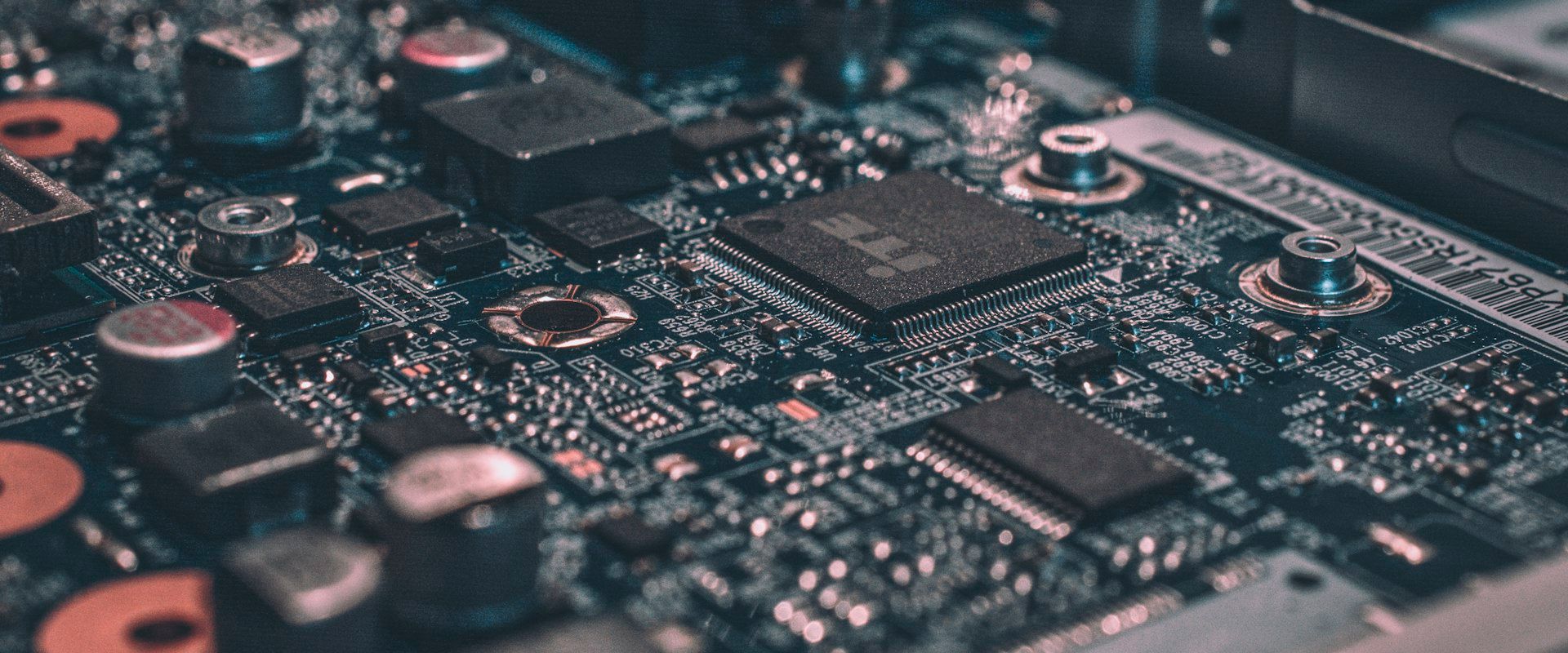 Technology industry - circuit board and microprocessor close-up representing tech innovation