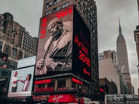 Music industry professional working on how billboard advertising can benefit music and entertainment businesses