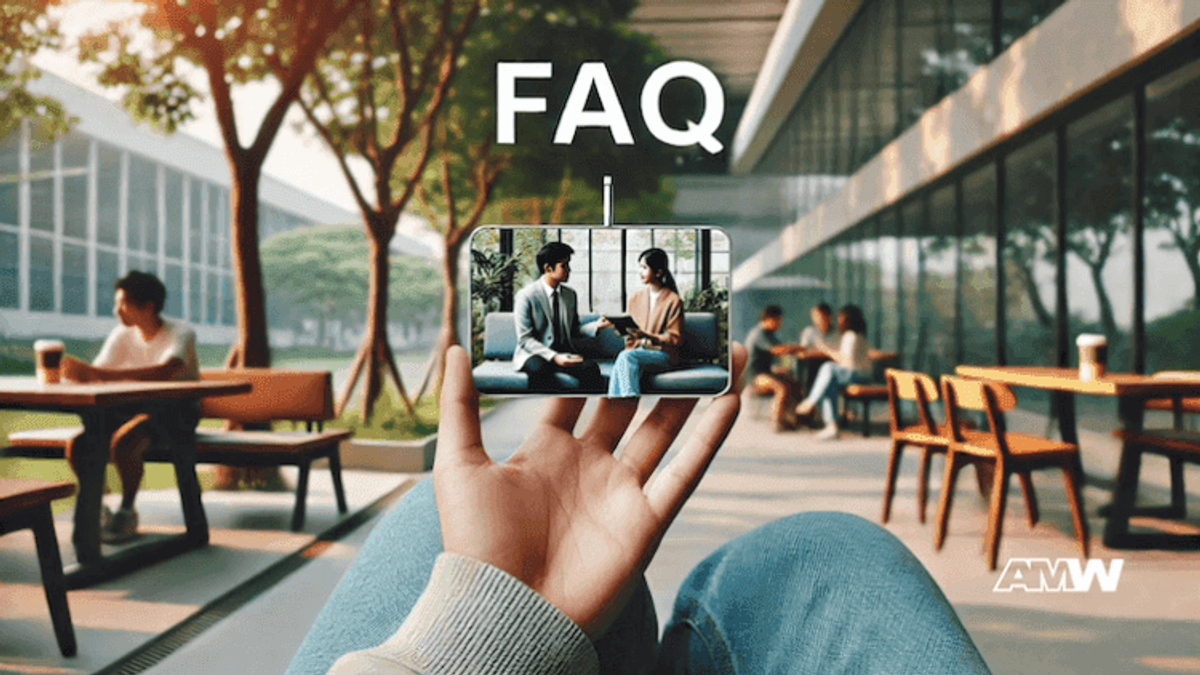 Hand holding phone showing FAQ video