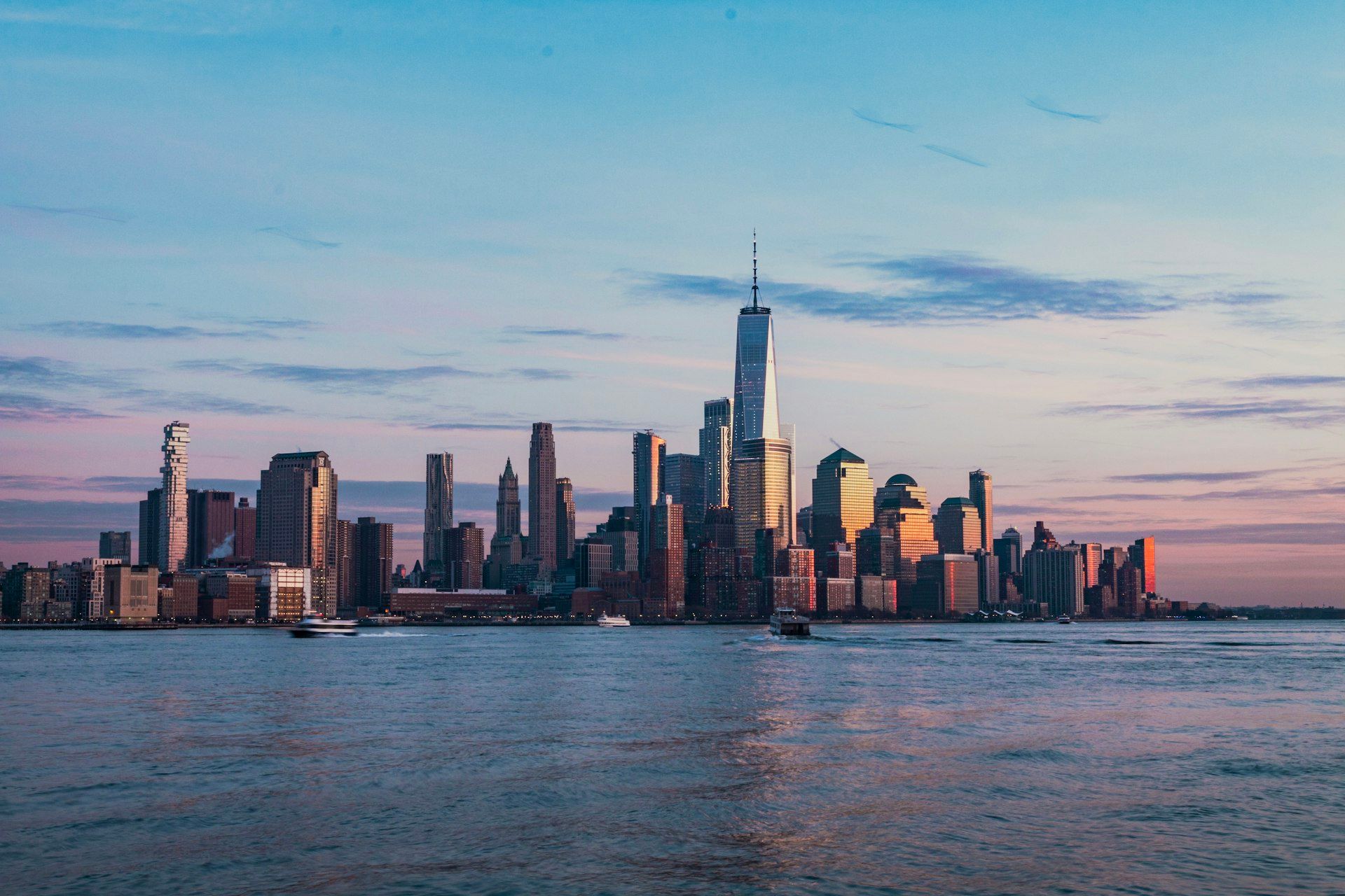 Lower Manhattan skyline at sunset viewed from across the Hudson River