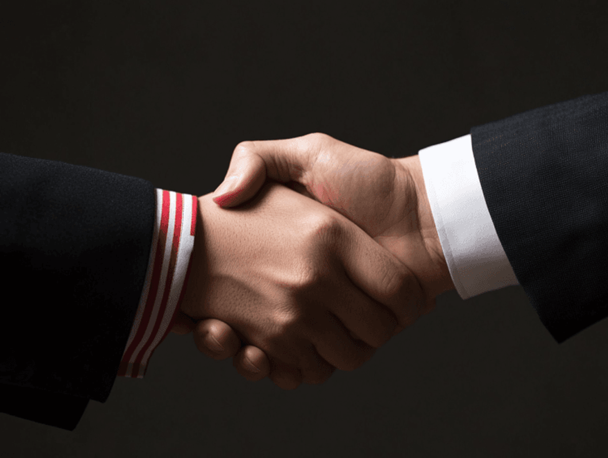 Business handshake with dark background