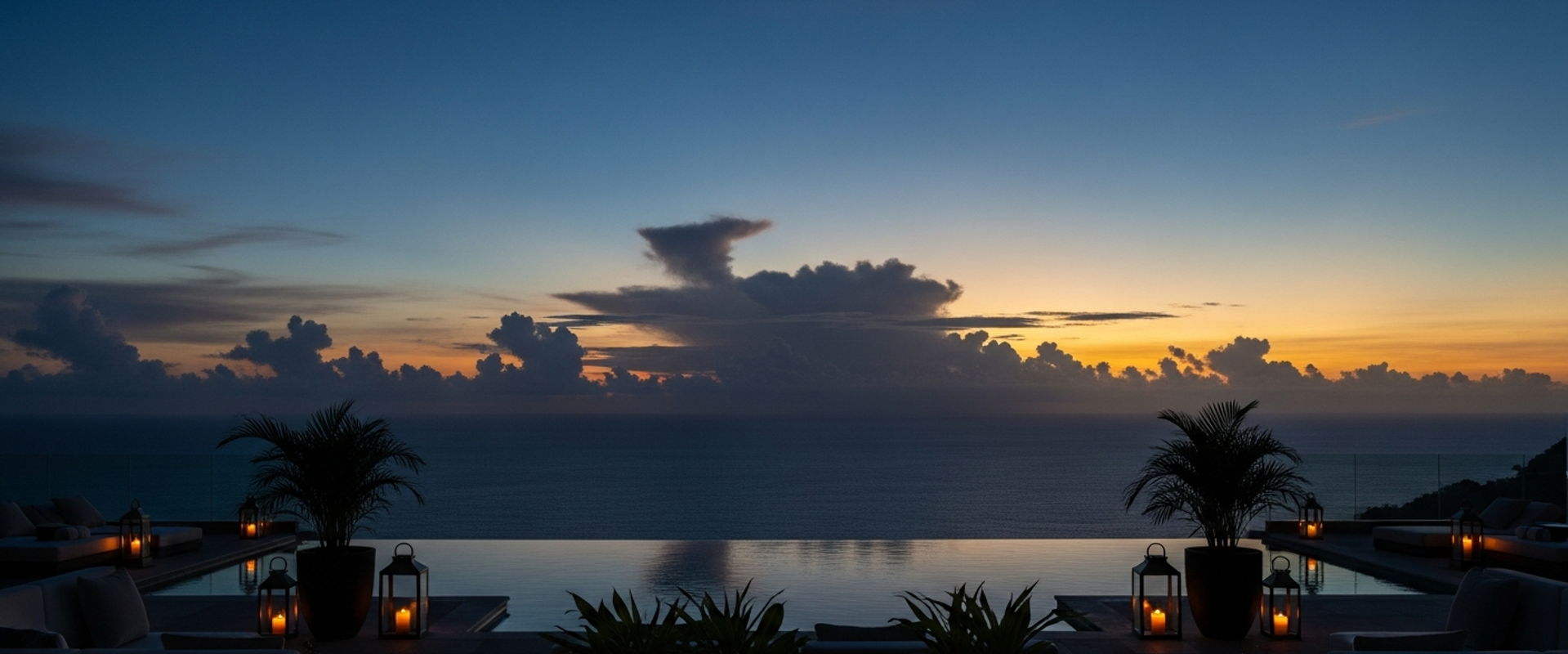 Luxury resort terrace overlooking ocean at dusk
