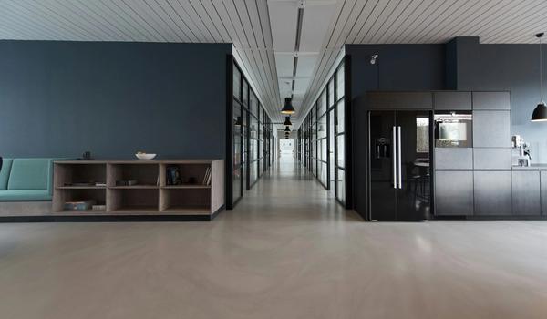 Modern office workspace with panoramic city view representing local and remote PR work