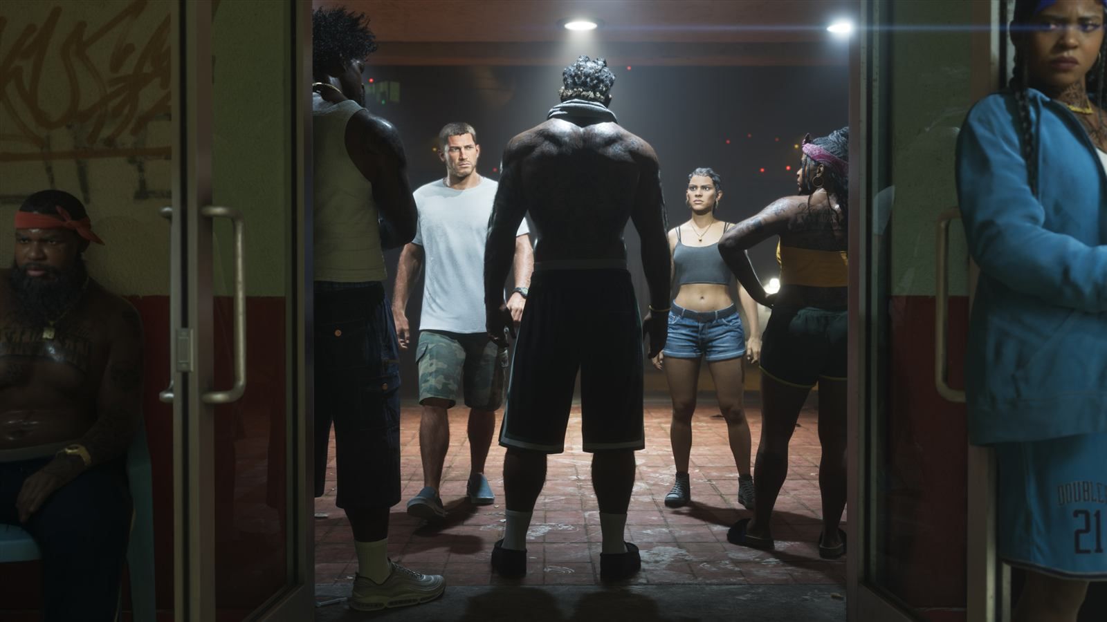Jason Duval and Lucia Caminos standing in a crowded fight-club doorway at night — official Grand Theft Auto VI screenshot
